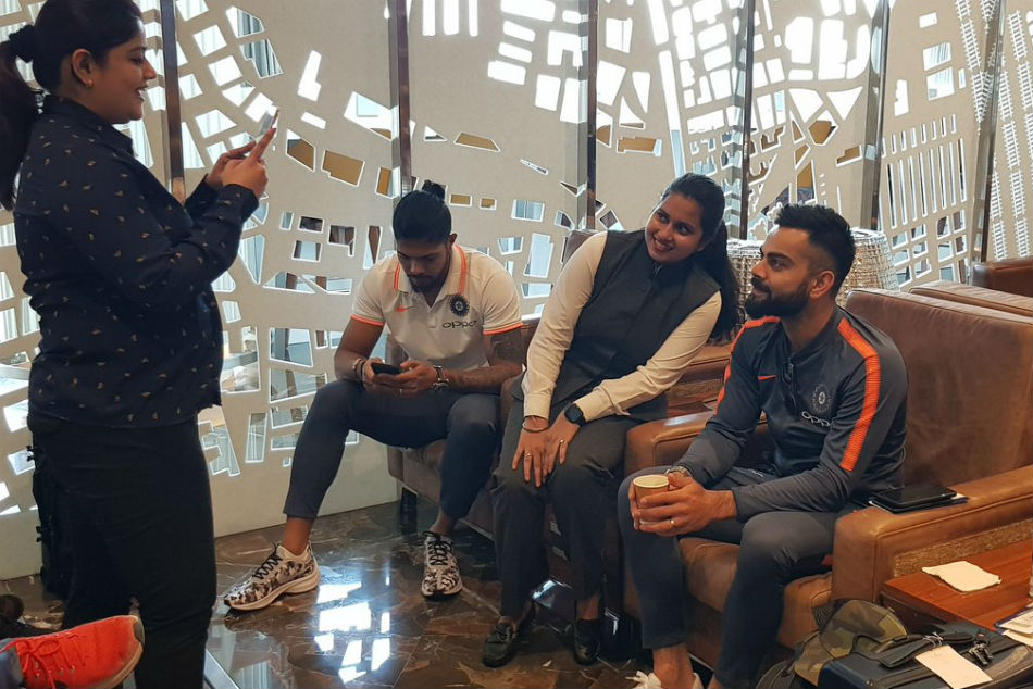 Kohli poses for a fan