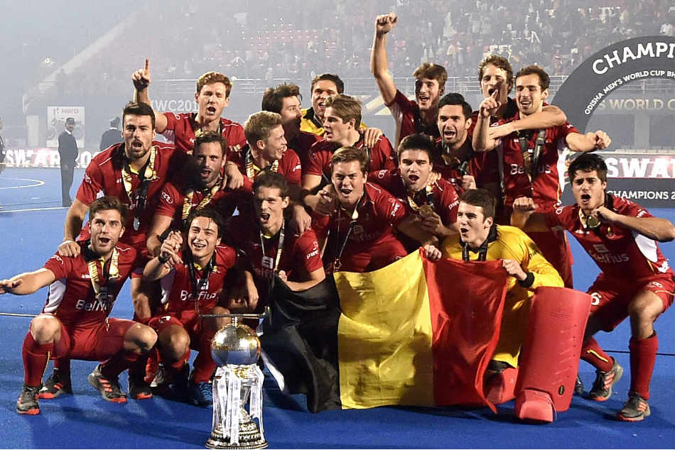 Belgium players celebrate their maiden hockey world cup title
