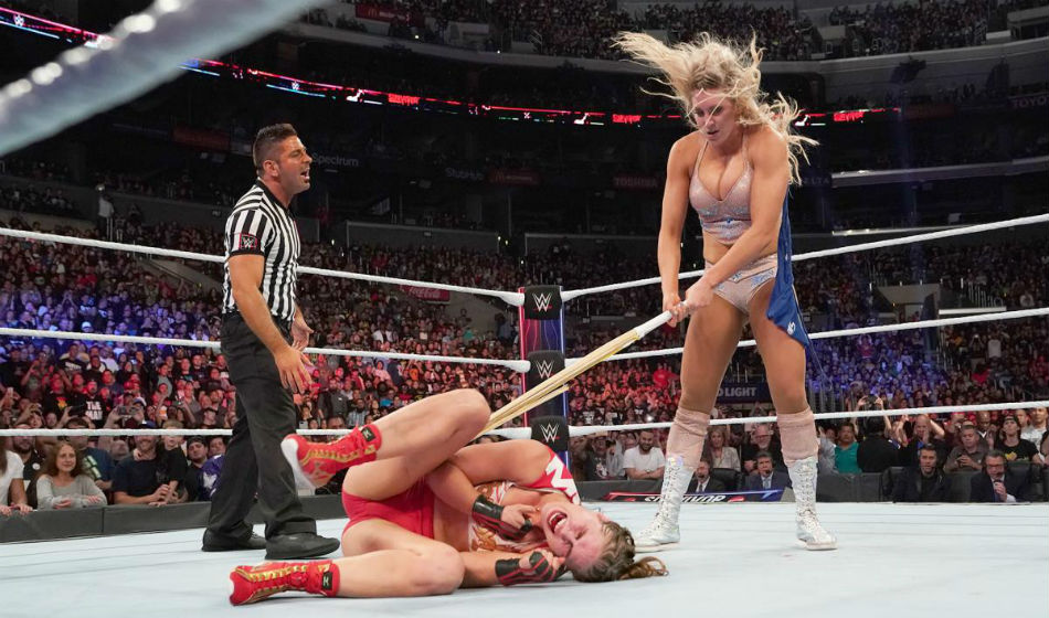 Charlotte Flair iattacks Ronda Rousey at Survivor Series (image courtesy WWE.com) Charlotte Flair iattacks Ronda Rousey at Survivor Series (image courtesy WWE.com)