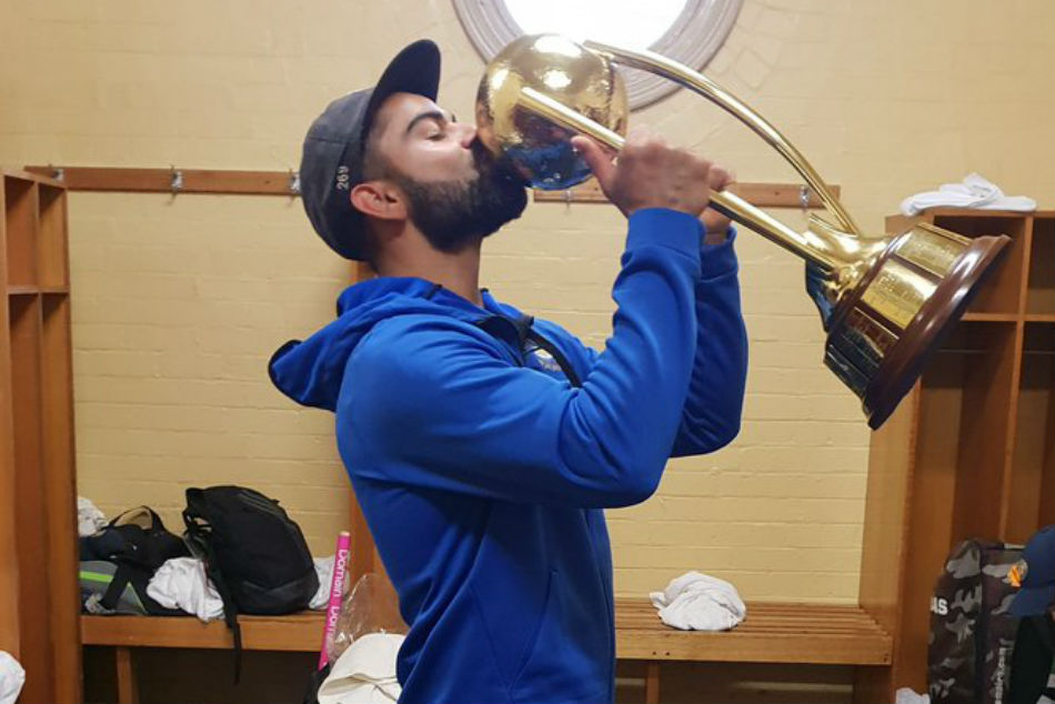 Kohli kisses the trophy