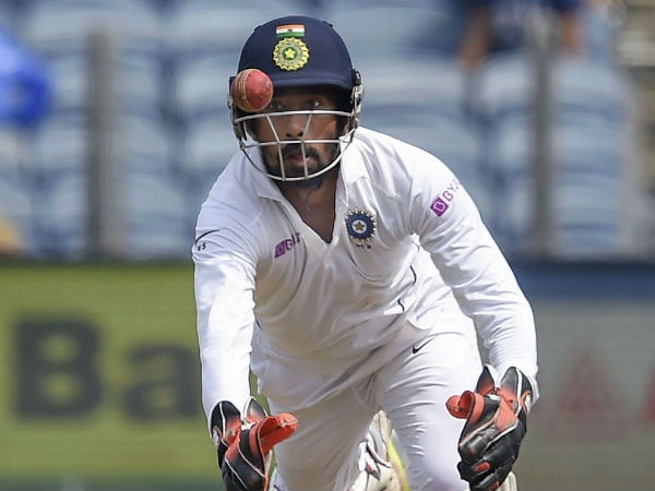 3. Pujara, Saha try to catch record