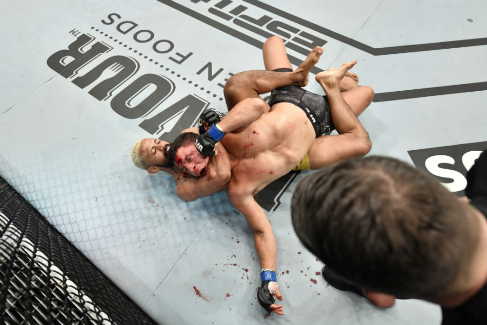 (L-R) Deiveson Figueiredo submits Joseph Benavidez during UFC Fight Island 2 (Photo by Jeff Bottari/Zuffa LLC via Getty Images) (L-R) Deiveson Figueiredo submits Joseph Benavidez during UFC Fight Island 2 (Photo by Jeff Bottari/Zuffa LLC via Getty Images)