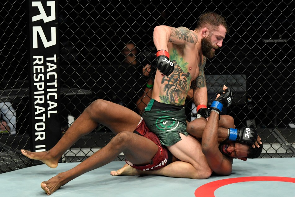 (L-R) Michael Chiesa punches Neil Magny during main event of UFC Fight Island 8. (Photo by Jeff Bottari/Zuffa LLC) (L-R) Michael Chiesa punches Neil Magny during main event of UFC Fight Island 8. (Photo by Jeff Bottari/Zuffa LLC)