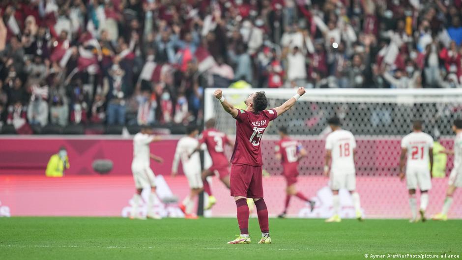Bassam Hisham (foreground) celebrates Qatars first of five goals against the UAE