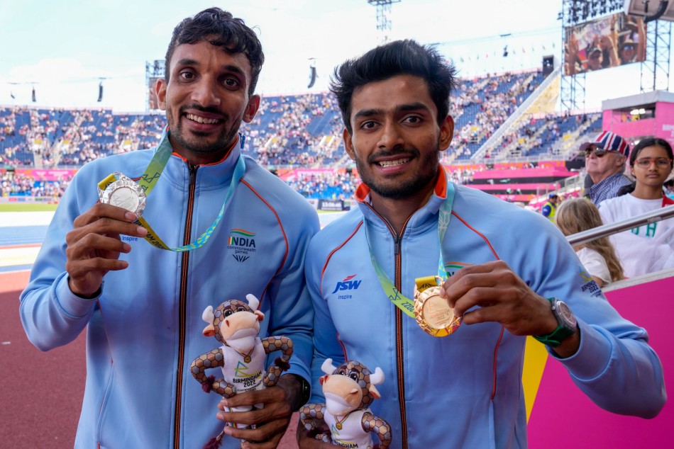 Mens triple jump gold medalist Eldhose Paul, right, of India stands with silver medalist and compatriot Abdulla Aboobacker Narangolintevida, left.