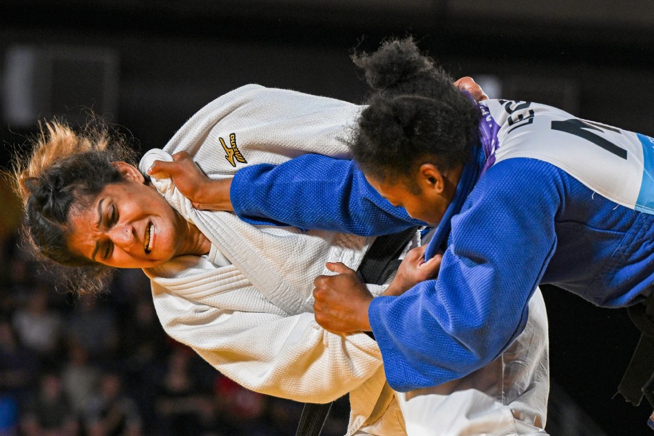 Indias Suchika Tariyal and Marie Christianne Legentil of Mauritius in action during the bronze medal match in the womens 57kg category Judo event at the Commonwealth Games 2022 