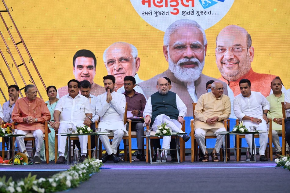 Union Ministers Amit Shah and Anurag Thakur at the 36th National Games anthem and mascot launch event in Ahmedabad Union Ministers Amit Shah and Anurag Thakur at the 36th National Games anthem and mascot launch event in Ahmedabad