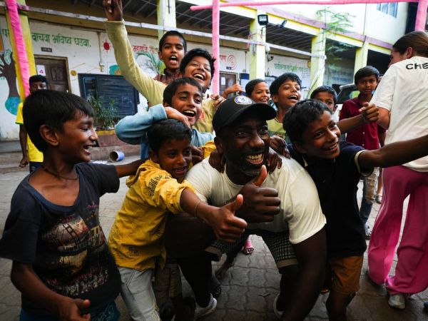 Chelsea FC legend Jimmy Floyd Hasselbaink with kids in Mumbai