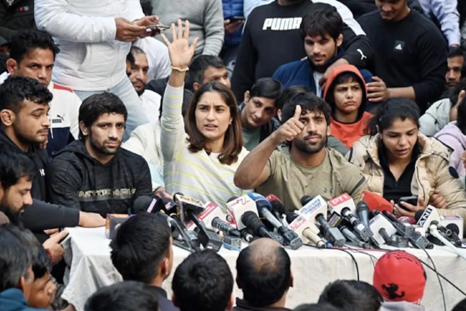 wrestlers sitting on protest