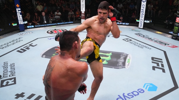 (R-L) Vicente Luque kicks Rafael Dos Anjos during UFC Vegas 78 main event. (Photo by Al Powers/Zuffa LLC via Getty Images)