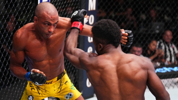 (L-R) Edson Barboza and Sodiq Yusuff trade punches in a featherweight fight during UFC Vegas 81. (Photo by Chris Unger/Zuffa LLC via Getty Images)