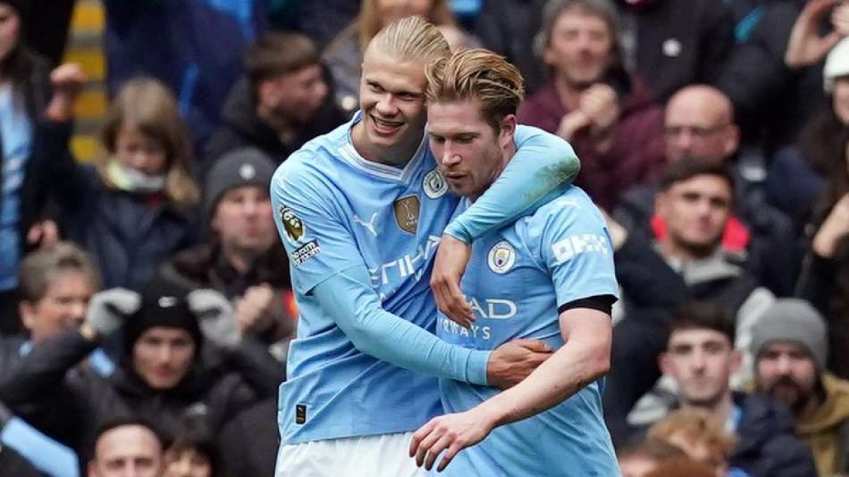 Erling Haaland, left, celebrates scoring his second goal with Kevin De Bruyne