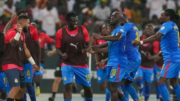 Yoane Wissa, centre, celebrates with team-mates after scoring his side’s second goal (Themba Hadebe/AP)