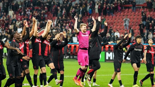 Bayer Leverkusen celebrate Sunday s victory over Wolfsburg which moved them 10 points clear at the top of the Bundesliga table