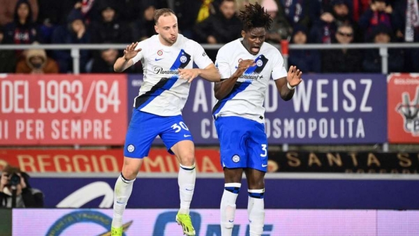 Yann Bisseck right celebrates scoring for Inter Milan