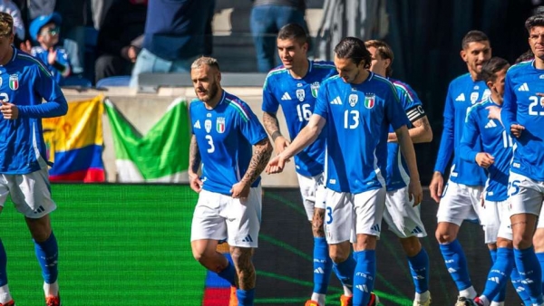 Italy s players celebrate after scoring a goal against Ecuador