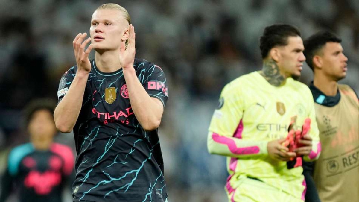 Manchester City s Erling Haaland left applauds the fans