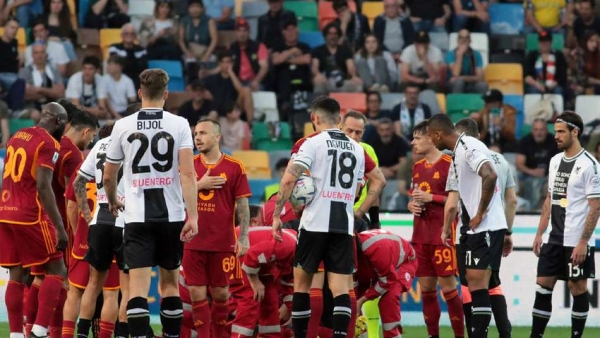 Roma s Evan Ndicka receives treatment on the pitch after collapsing during the Serie A clash with Udinese