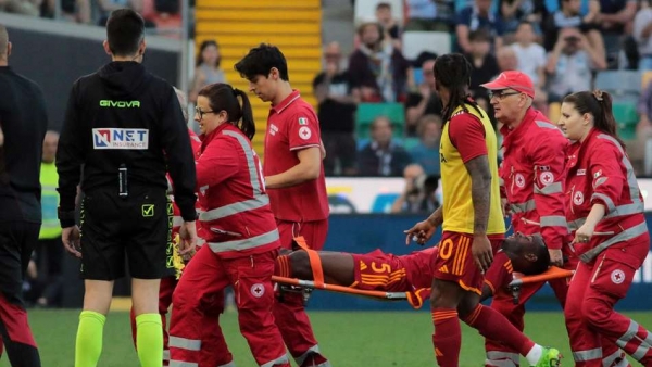 Roma s Evan Ndicka is carried from the pitch on a stretcher