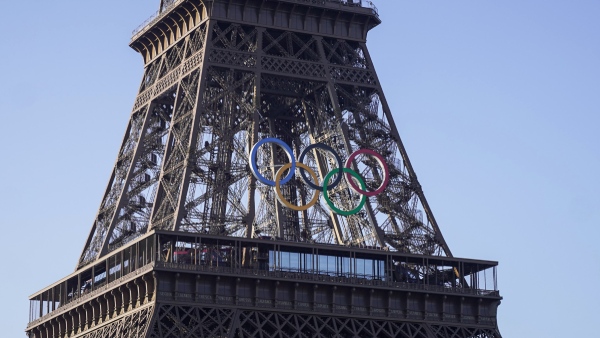 Paris Olympics organisers unveil a display of the five Olympic rings mounted on the Eiffel Tower