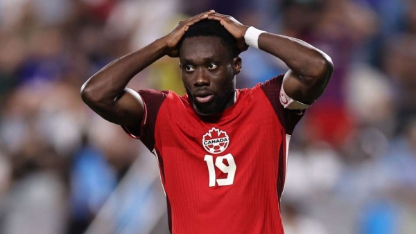Alphonso Davies of Canada reacts after missing his spot kick in Copa America 2024 third-place playoff against Uruguay