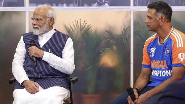 Prime Minister Narendra Modi and India head coach Rahul Dravid