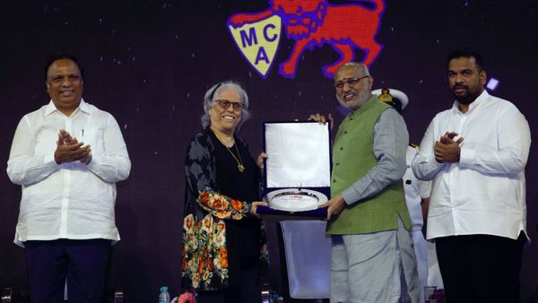 Maharashtra Governor C P Radhakrishnan presents the Mumbai Cricket Association MCA Lifetime Achievement Award to former Indian cricketer Diana Edulji
