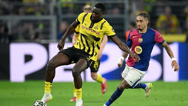 Barcelona Advances Despite Dortmund Defeat