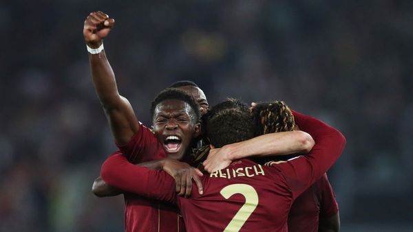 Roma Defeats AC Milan to Stay in Champions League Race