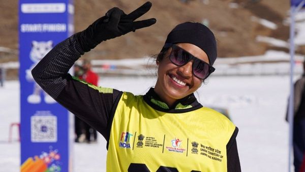 The finish line arrived quietly almost reverently as if the snow itself understood what it meant Kajal Kumari Rai did not raise her arms immediately She slowed her skis whispering over Gulmarg s powder her breath visible in the mountain air For a moment she simply stood there eyes searching somewhere far beyond the white expanse somewhere beyond the cheering officials beyond the medals beyond the moment Somewhere perhaps where her father still lives Then the realisation settled in Another gold medal Her second in as many days And suddenly the grief the promise the year-long burden Kajal had carried alone all found its answer in gold https www instagram com reel DVG4zzpkq4m igsh eDA0ajAwcWE4MXJ5 Just five days before the Khelo India Winter Games in 2025 Kajal s world had collapsed Her father died unexpectedly forcing her to abandon training and return home to Shillong for his last rites The rituals ended but the grief did not Still Kajal returned to Gulmarg to compete carrying shock and sorrow heavier than any snowfall Nordic skier Kajal raced last year but her body moved without her spirit The mountains felt colder then The snow indifferent But somewhere in that silence the CRPF cross-country athlete made herself a promise She would come back And she would win not for herself but for her father This February on the Golf Course at Gulmarg she kept that promise On Monday the 25-year-old from Meghalaya won gold in the Nordic Women s 15 km sprint On Tuesday she returned and did it again claiming gold in the 10 km sprint completing a sweep that transformed grief into glory Two races Two gold medals One daughter fulfilling a promise Kajal s journey to this moment makes the achievement even more improbable Kajal comes from a land of rain and green hills not snow and ice Nordic skiing is not just uncommon there it is almost unimaginable We don t have this kind of weather she said Even surviving in snow is a big deal for us Forget competing in a sport that tests your endurance like this She had only started skiing in 2024 No family history No childhood winters on skis No legacy to inherit Just belief For the past three weeks Kajal trained relentlessly at the Indian Army s High Altitude Warfare School HAWS in Gulmarg There she learned not just technique but survival how to move with the snow how to endure it and how to belong in it They trained us well she said They improved our technique and gave us confidence The mountains once foreign became familiar She found herself mesmerised by Kashmir its vast silence its powdery snow its beauty The natural views are amazing Kajal said The snow here is perfect for Nordic skiing But Kajal s strength was forged long before Gulmarg She serves in the CRPF where endurance is not optional but an identity It was there she discovered endurance sports It was there she watched Army athletes compete at the Olympics and World Championships It was there she allowed herself to dream Her team manager Magesh K saw that transformation first-hand She has always worked extremely hard he said But more than that she has the spirit of an athlete That spirit is rare Mangesh saw it again at the finish line today Another CRPF skier Hiral from Gujarat had just won bronze Kajal fresh off her own victory walked to her and embraced her They celebrated together not as rivals but as soldiers as sisters Victory had not hardened her It had humanized her Back home in Shillong her mother sister brother and sister-in-law were eagerly waiting for the results from afar and soon after the win she called them over video and broke the good news to them No one in Kajal s family had ever pursued sports professionally No one had walked this path before her She carved it herself Kajal credits her friend and fellow CRPF soldier Lokesh Kumar for helping her believe she could But belief alone was never enough Consistency was I saw athletes from states without infrastructure succeed Kajal said I promised myself I would not complain I would focus on my goal She did And now standing in Gulmarg with two gold medals Kajal Kumari Rai is no longer just a participant She is no longer just a skier from a state without snow She is a champion And somewhere perhaps beyond the mountains beyond the sky beyond the finish line a father s promise has been kept Her journey Kajal says is only beginning She now dreams of the Olympics Of World Championships Of carrying her story her father s story onto the world stage Because some victories are measured not in seconds but in courage And some gold medals weigh more than others
