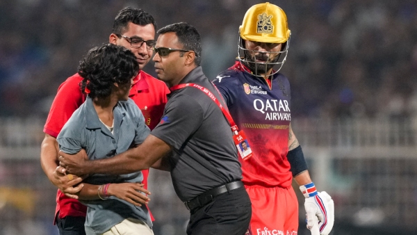 Virat Kohli Creates History in IPL Fan Touches His Feet in a Heartfelt Pitch Invasion