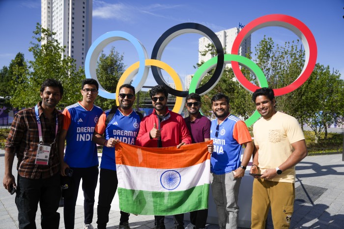 Paris: Actor Ram Charan poses for photos with fans after India's PV Sindhu’s badminton match in the Women's Singles Group play stage event at the Summer Olympics 2024