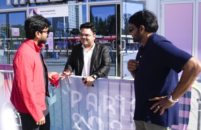 Paris: Actors Chiranjeevi and Ram Charan interact with BCCI Secretary Jay Shah after India's PV Sindhu’s badminton match in the Women's Singles Group play stage event at the Summer Olympics 2024