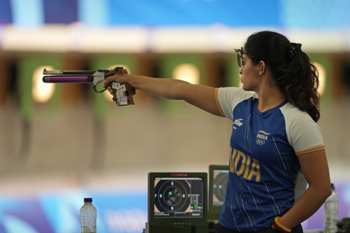 India's Manu Bhaker takes aim during the 10m Air Pistol Women Pre-event Training at the 2024 Summer Olympics