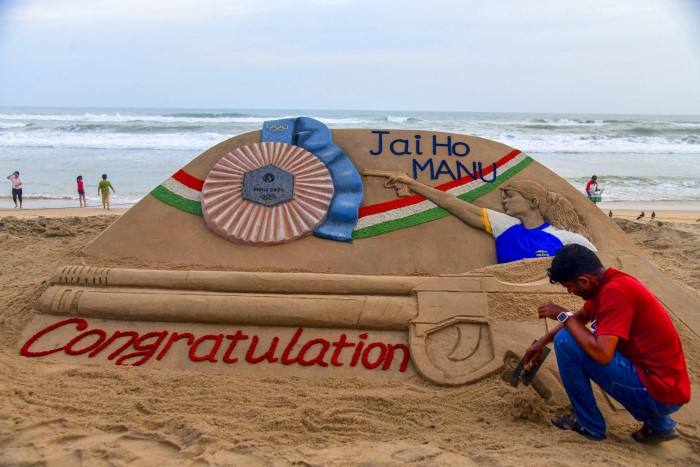 Puri: Renowned sand artist Sudarsan Pattnaik creates a sand sculpture congratulating shooter Manu Bhaker for winning Bronze medal at Paris Olympics 2024