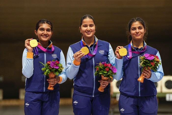 Hangzhou: (R-L) Gold medallist Indian shooters Esha Singh, Rhythm Sangwan and Manu Bhaker pose for photos
