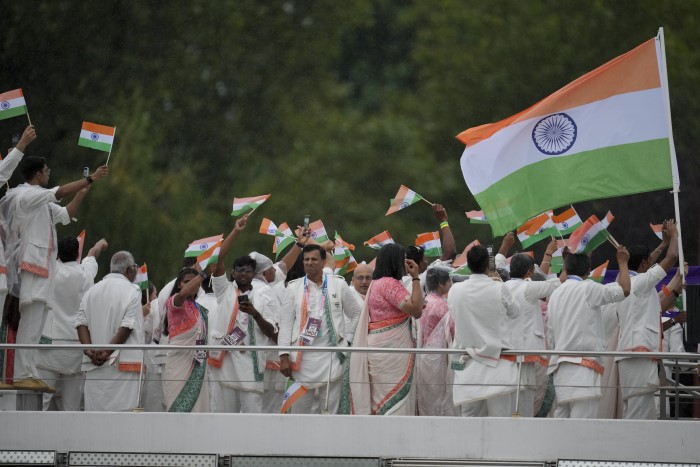 Athletes from India travel by boat down the Seine River in Paris, France, during the opening ceremony of the 2024 Summer Olympics, Friday, July 26, 2024