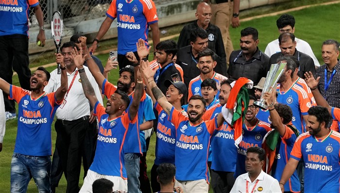 Players of the T20 World Cup-winning Indian cricket team take a victory lap during a felicitation ceremony at the Wankhede Stadium.