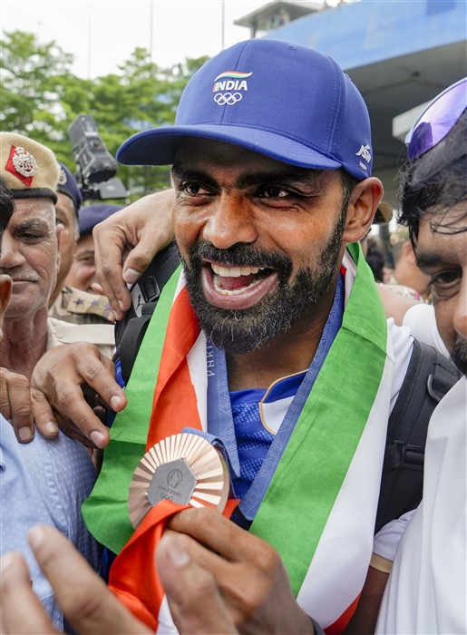 Paris Olympics Bronze medallist Indian Hockey player PR Sreejesh after his arrival at the Indira Gandhi International Airport, in New Delhi.