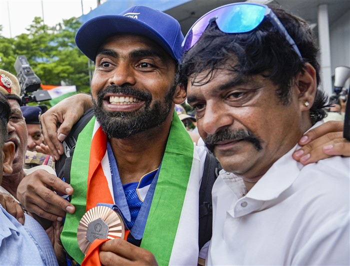 Paris Olympics Bronze medallist Indian Hockey player PR Sreejesh being welcomed after his arrival at the Indira Gandhi International Airport, in New Delhi.
