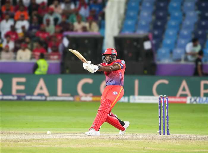 Rovman Powell Smashing for a boundary.