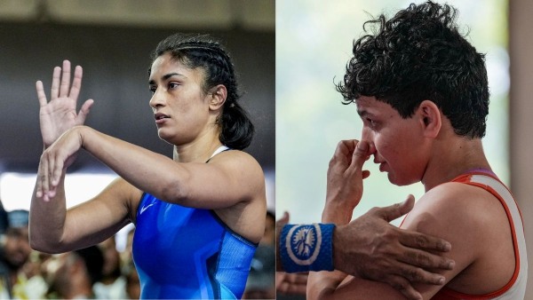 Vinesh Phogat and Sanjay Singh Clash Amid Chaos and Bottle Throwing in Asian Games Wrestling Trials Vinesh Phogat and Sanjay Singh Clash Amid Chaos and Bottle Throwing in Asian Games Wrestling Trials