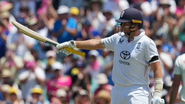 Joe Root celebrating his historic cricket milestone on pitch Joe Root celebrating his historic cricket milestone on pitch