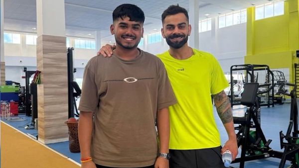 Virat Kohli interacting with Ayush Mhatre in Bengaluru