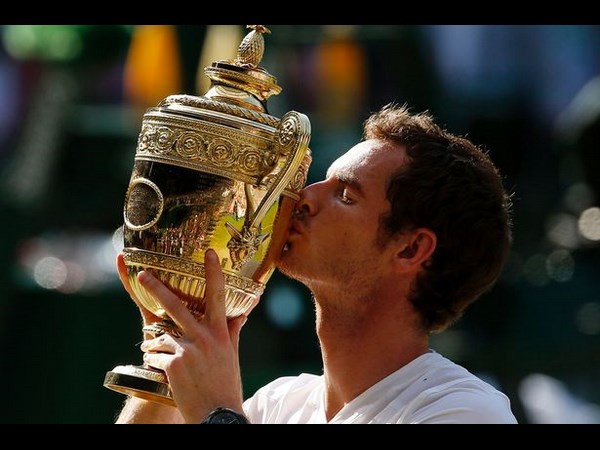 ట్రోఫీని ముద్దాడుతూ..