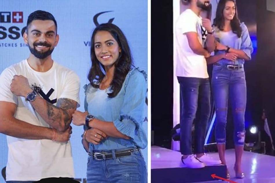 Virat Kohli at the receiving end for trying to match the height of Tennis star Karman Kaur Thandi Virat Kohli at the receiving end for trying to match the height of Tennis star Karman Kaur Thandi