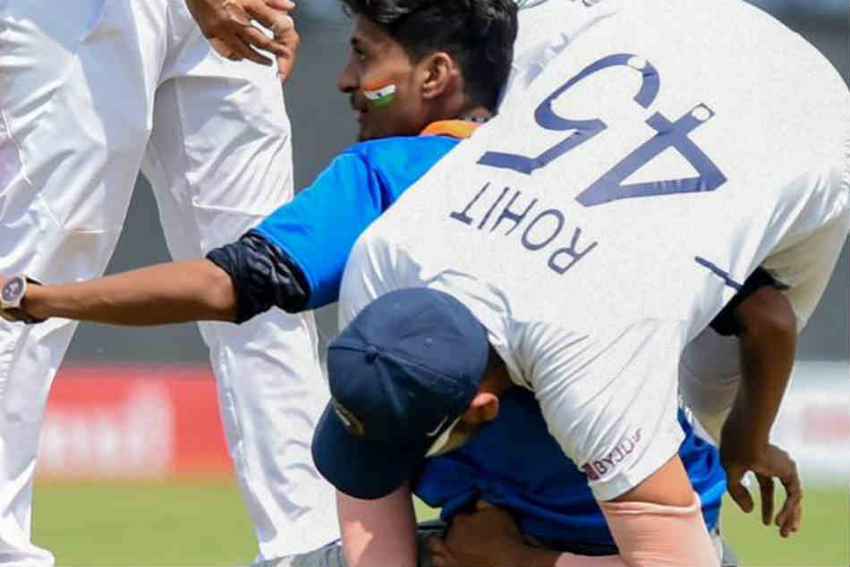IND vs SA: Fan invades pitch to touch Rohit Sharmas feet in Pune Test IND vs SA: Fan invades pitch to touch Rohit Sharmas feet in Pune Test