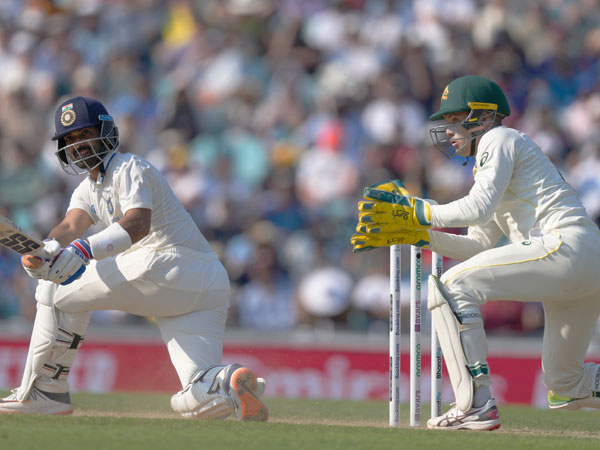 Umpire gives signal to Lyon trying to save a review for Aussies.