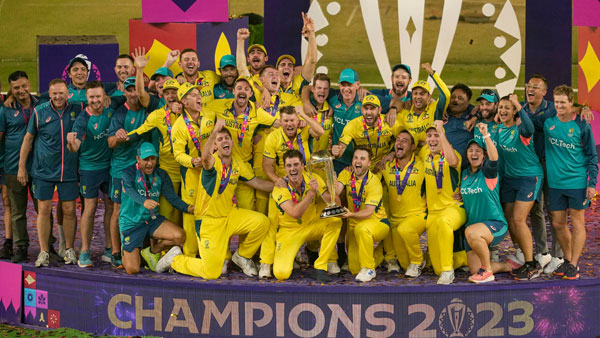  Australian players celebrate with the trophy after winning the ICC Mens Cricket World Cup 2023