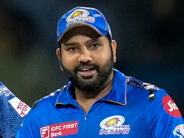 IPL 2024 Rohit Sharma Shocks After A Fan Breaches Security To Hug Him During MI vs RR Match